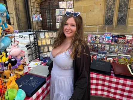 Anastasia Maseychik smiles from her market stall