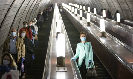 People wear face masks and gloves on the Moscow Metro. Russia now finds itself with the second fastest rate of Covid-19 infections in the world.
