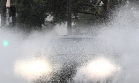 Car driving in rain