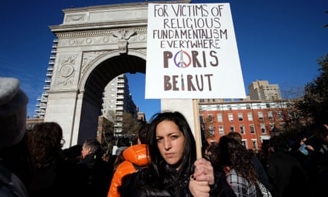 A woman displays a placard during a vigil to show solidarity with the citizens of France on November 14, 2015 in New York.