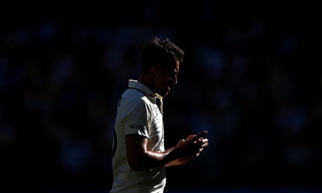 Mitchell Starc walks back to his mark on a tough day for Australia in the first Test of the Border-Gavaskar Trophy series.