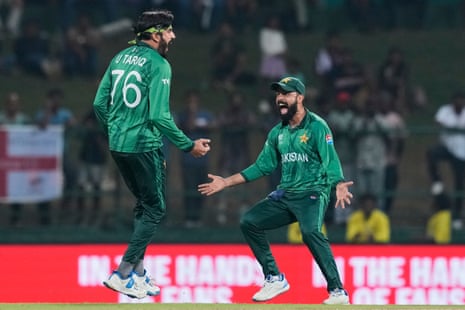 Pakistan's Usman Tariq (left) celebrates with Pakistan's Babar Azam after taking the wicket of England's Tom Banton.