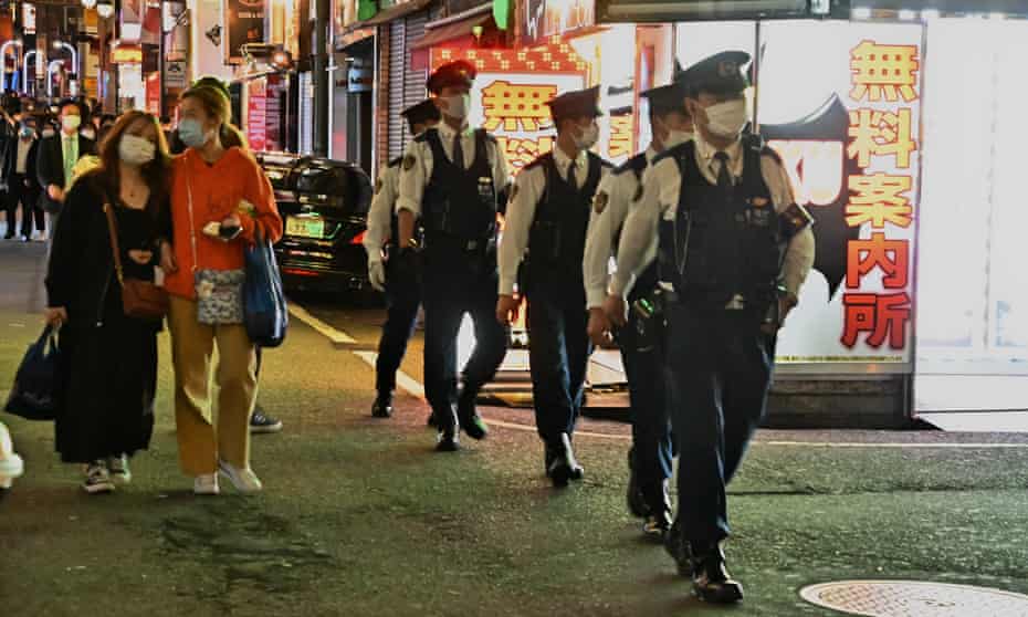 Members of Tokyo Metropolitan Police Department patrol at Kabukicho shopping and entertainment district in Tokyo, Japan on Friday, 30 April 2021. The organisers of the Tokyo Olympics have been forced to abandon plans to allow the sale of alcohol at venues after public outcry.