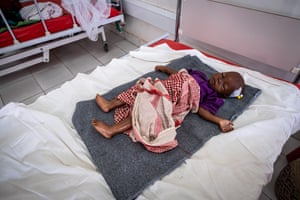 Maryam Hassan on a bed in the intensive care unit.