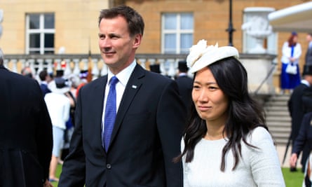Jeremy Hunt and his wife, Lucia Guo, at Buckingham Palace