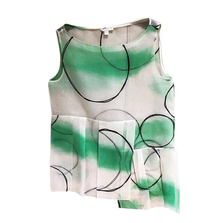 white top with green and black graphic design