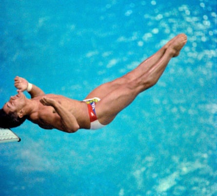 In this file photo taken on September 19, 1988 Two-time Los Angeles gold medalist Greg Louganis of the U.S. bangs his head against the board after mistiming his dive during the Olympic competition, 19 September 1988 in Seoul