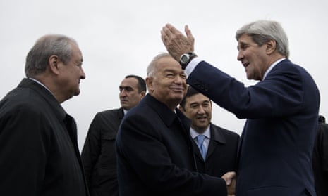 Uzbek Foreign Minister Abdulaziz Kamilov (L) looks on while Uzbek President Islam Karimov (C) and US Secretary of State John Kerry (R) shake hands at Samarkand Airport on November 1, 2015 in Samarkand. Kerry is in the region as he visits 5 Central Asian nations. AFP PHOTO/POOL/BRENDAN SMIALOWSKIBRENDAN SMIALOWSKI/AFP/Getty Images