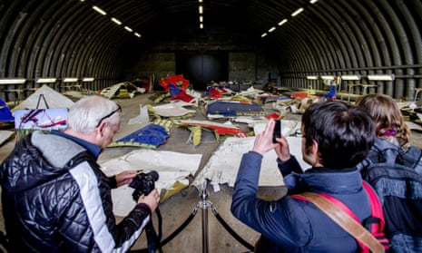 Friends and families of MH17 victims inspect the wreckage at Gilze-Rijen airbase in the Netherlands.