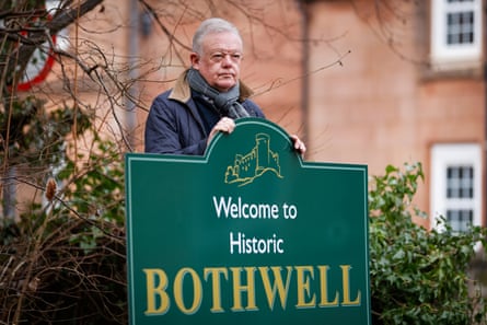 Kenny McCreary stands by a sign for Bothwell.