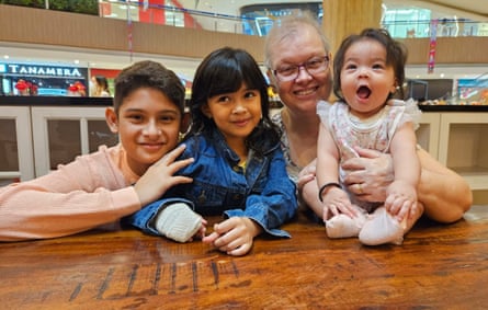 Jacquita Gonzales, 61, with her grandchildren on her birthday in January. Her husband, Patrick Gomes, was the flight supervisor on MH370