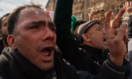 A man chants during the funeral procession of Mazen al-Hamada in Damascus