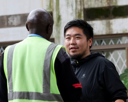 Zhang Kequn stands outside the courtroom before his sentencing at the Jomo Kenyatta International Airport Law Courts in Nairobi in April.