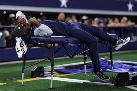 Micah Parsons’ acrimonoious holdout included the All-Pro edge rusher slumped on a training table behind the team bench during a preseason game while the team was on offense.