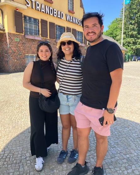 The three smile for the camera in front of the lido.