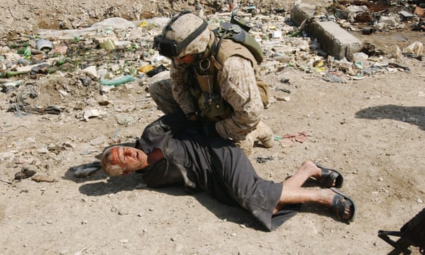 A US marine arrests an Iraqi man on 23 March 2005 in Ramadi, one of the cities worst affected by terror attacks.