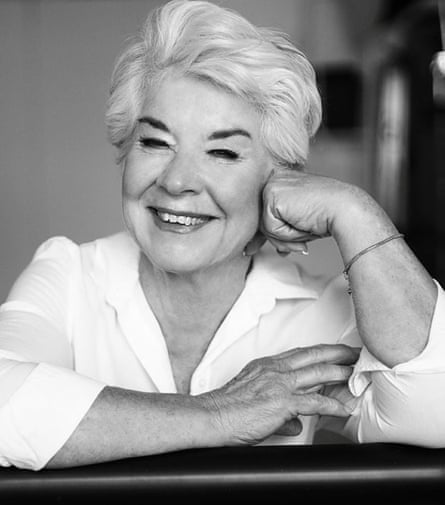 white haired woman poses for a portrait