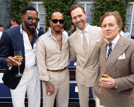 Colman Domingo, Lewis Hamilton, Tom Hiddleston and David Lauren smile as they pose for a photograph