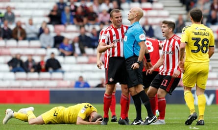 Lee Cattermole is about to be booked against Fleetwood. ‘There were probably 16 different opinions on Lee,’ says Jack Ross.