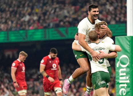South Africa's Ethan Hooker (right) celebrates scoring their side's second try of the game.