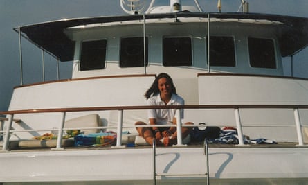 Charlotte Drury sitting in the sunshine on a yacht.