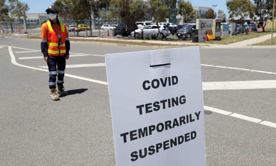 A sign saying ‘Covid testing temporarily suspended’ is seen at a drive-through COVID-19 testing site at in Melbourne