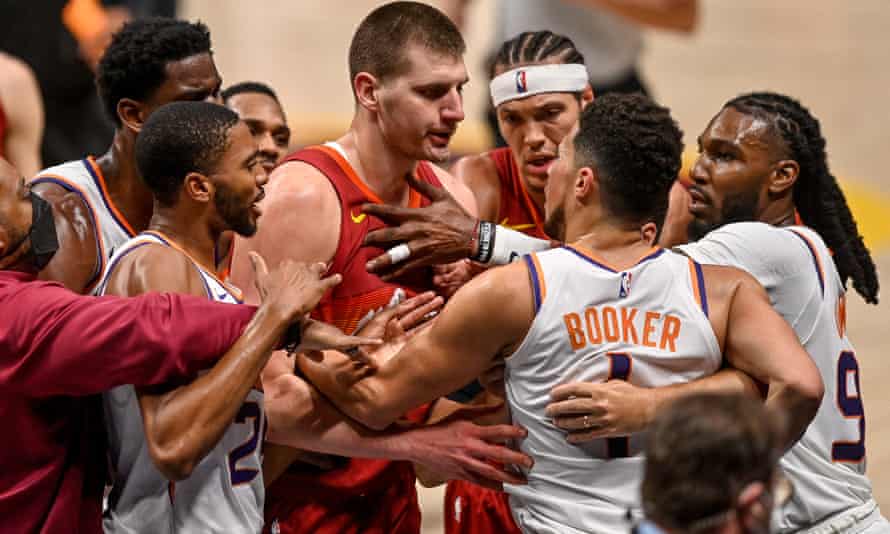 Nikola Jokic and Devin Booker exchange words after a play that would result in the NBA MVP being ejected from Sunday’s game