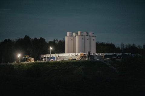 Large sand silos, which are used to store fracking sand, are seen at an oil drilling site operated by Coterra, in Dimock, Pennsylvania, in October.