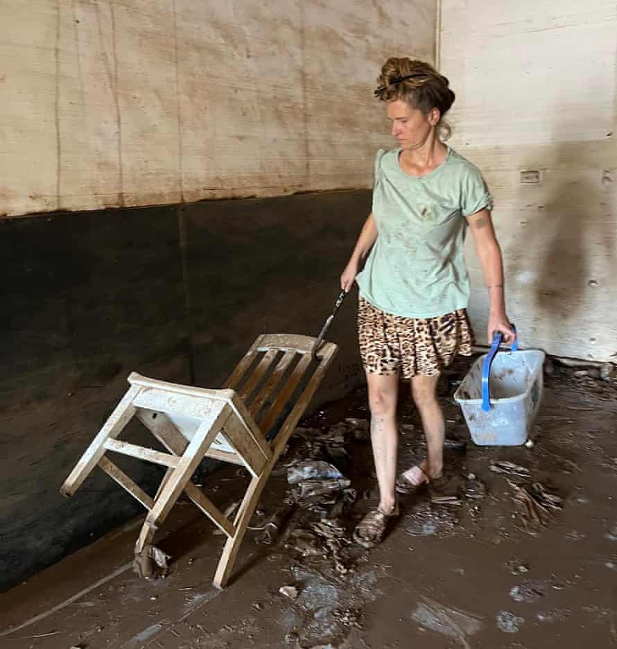 Antoinette O’Brien clenaing up after the floods.