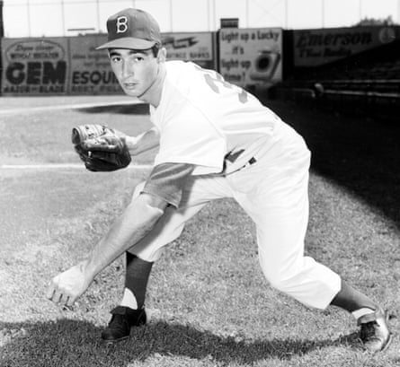 Sandy Koufax of the Los Angeles Dodgers smiles as he holds a baseball on  May, 12, 1963 symbolizing his second no-hitter in less than a year. He  pitched his first no-hitter against