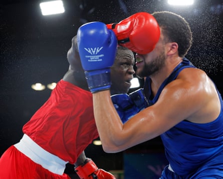 Aziz Abdul of Uganda (in red) and Damar Thomas of England (in blue) in action during the men’s 90+kg quarter-final bout
