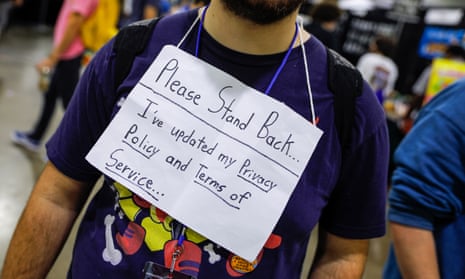 An attendee at a gaming convention in Atlanta, Georgia, with a GDPR sign