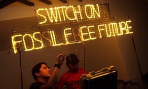 Volunteers set up an LED banner for Earth Hour last year.