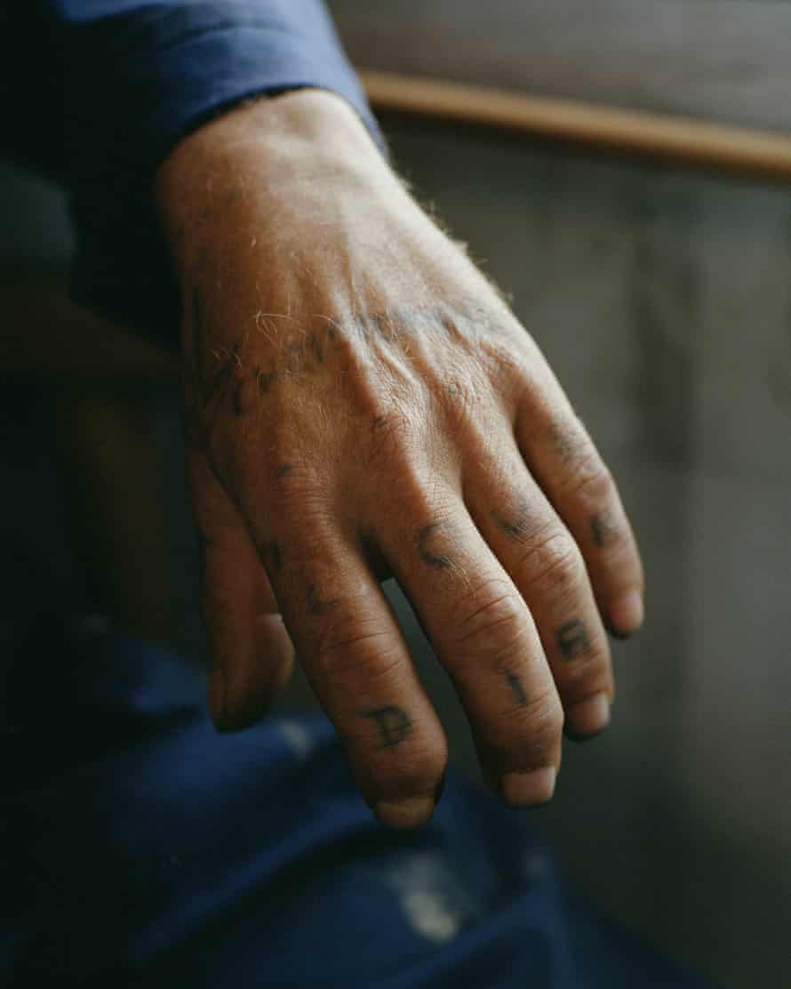 Tattooed man’s hand (2020), from the series Land Loss