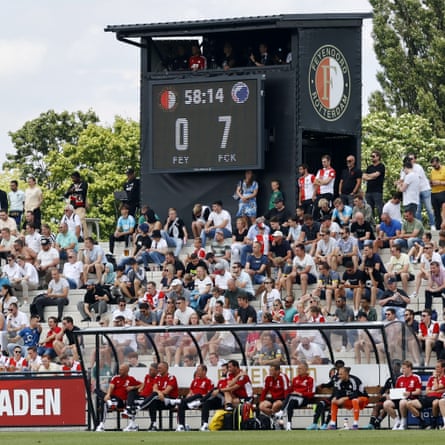 Arne Slot (left of dugout) digests a 7-0 pre-season battering astatine location to Copenhagen successful July 2022
