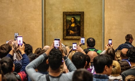 Don’t moaner Lisa? Tourists at the Louvre in Paris.