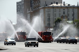 Moscow, Russia: Vehicles spray water over Sadovoye Koltso Street to stop the tarmac overheating.