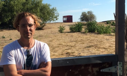 Gabriel Wrye in his garden overlooking Rob Rhinehart’s container.