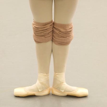 Students from the New National Theatre Ballet School take part in a daily ballet class