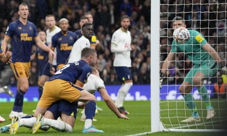 Harry Kane, in white and smothered by Kieran Trippier, scores Spurs’ only goal of the game but they lost 2-1