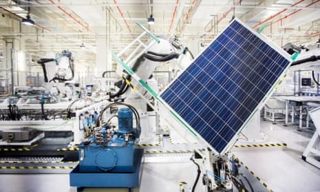 A robot handles a solar panel on the module production line in Singapore.