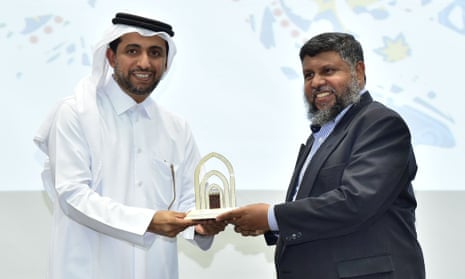 Prof Lukman Thalib, right, receives the outstanding teaching award at the Qatar University annual convocation in 2018. Thalib and his son were held for five months in Qatar and allegedly tortured.