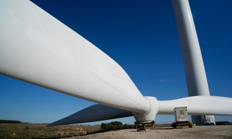 Wind turbine blades are assembled on the ground at a wind farm in Uruguay