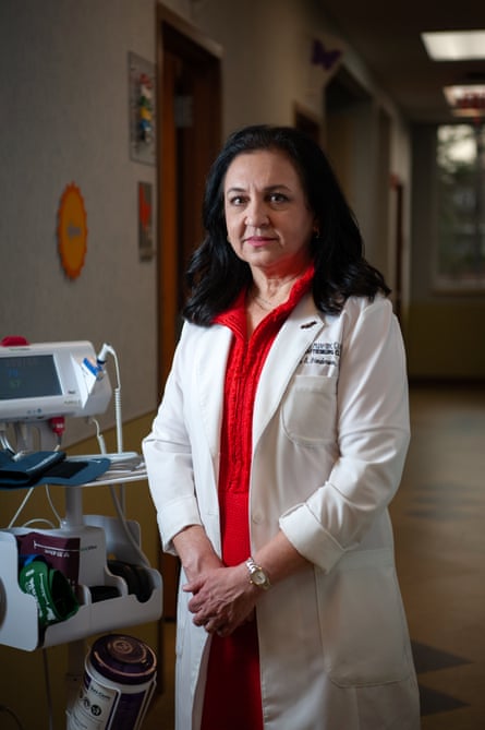 a woman wearing a white coat