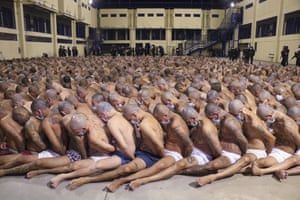 In this photo released by the Presidency Press Office, gang-member inmates of Izalco prison are subjected to maximum security measures after President Nayib Bukele ordered an emergency after increased homicides during the pandemic , San Salvador, El Salvador