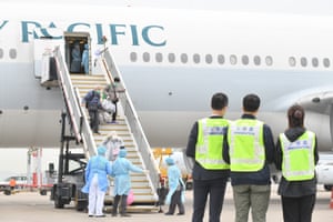 Passengers from the Diamond Princess arrive back in Hong Kong