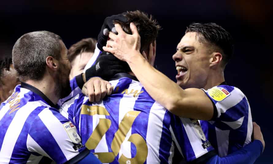Liam Shaw (centre) is mobbed by his Sheffield Wednesday teammates after scoring the winner against Middlesbrough.