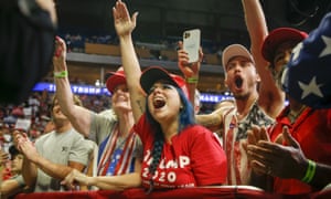 Attendees cheer while Donald Trump speaks during his campaign rally at The BOK Center in Tulsa, Oklahoma.