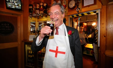 Nigel Farage grins with a pint in his hand and a St George's cross apron over his suit