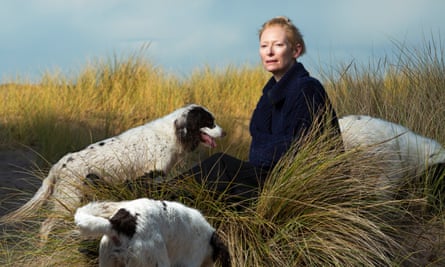 Tilda Swinton at Kingsteps Beach, Nairnshire, with her springer spaniels